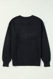 Black sweater on a light gray background