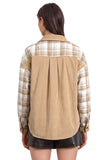 A woman viewed from the back wearing a long-sleeve button-up shirt with a tan corduroy back panel and beige-and-white plaid sleeves and yoke, paired with black shorts against a plain white background.