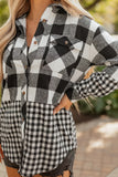 Person wearing a black and white checkered outfit with blurred background