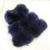 Blue fluffy slippers on a white background