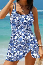 Woman wearing a blue floral dress on a beach