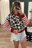 Woman in leopard-print cardigan with red-white striped sleeves and distressed denim short.