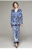 Woman wearing a blue and white patterned outfit on a gray background