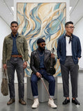 Three men posing in a modern indoor setting with abstract art in the background