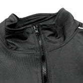Close-up of a black jacket with a zipper on a white background