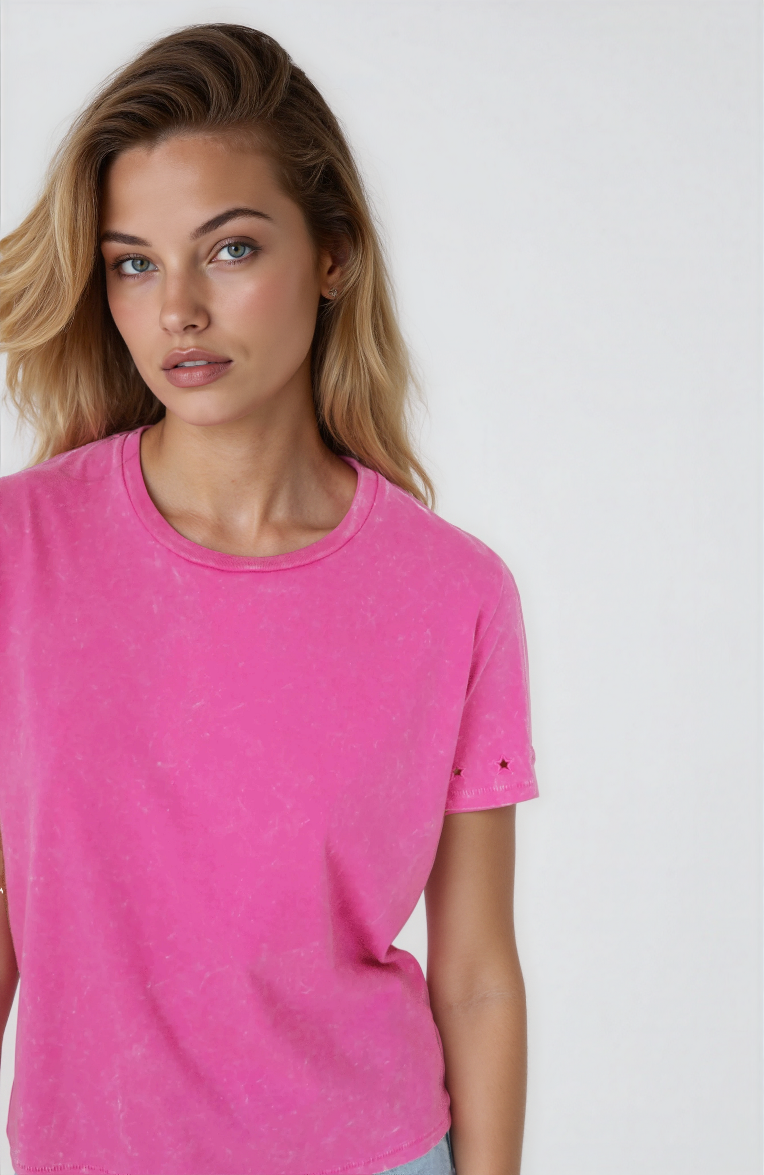 Woman wearing a pink t-shirt against a white background