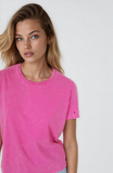 Woman wearing a pink t-shirt against a white background