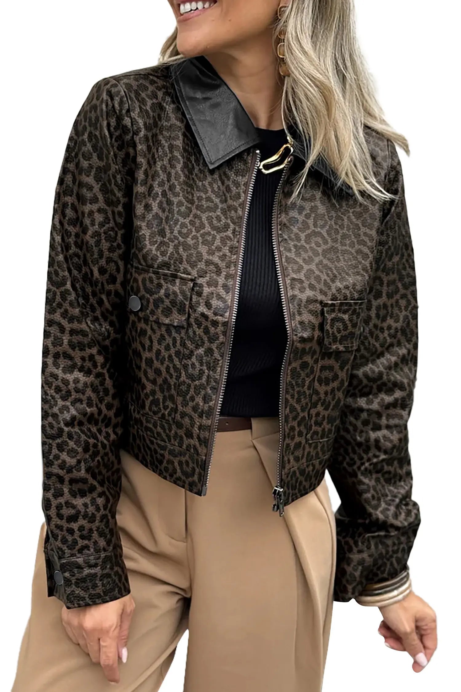 A woman wearing a cropped leopard-print jacket with a black collar, black top, and beige pants, shown against a plain white background.