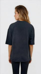 Person wearing a dark blue t-shirt on a white background