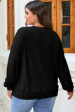 Woman shown from behind wearing a black crewneck sweatshirt with light blue jeans.