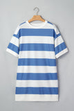 A short-sleeve crewneck T-shirt dress with horizontal blue and white stripes, hanging on a wooden hanger against a solid gray background.