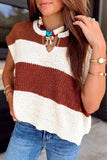 Woman in a brown and cream striped sweater vest with split neckline, jeans, and gold jewelry.