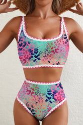 Multicolored leopard print bikini set on a plain background