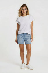Woman wearing a white t-shirt and denim shorts on a white background