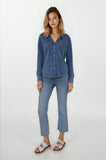 Woman wearing a blue shirt and jeans on a white background