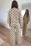 Back view of beige polka dot sweatshirt and pants set with dropped shoulders
