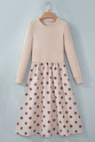Beige ribbed knit polka dot midi dress on a hanger, front view