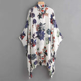 Floral patterned kimono-style garment on a gray background