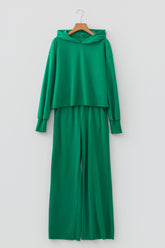 Bright green cropped hoodie and wide leg pants set on a hanger, front view