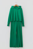 Bright green cropped hoodie and wide leg pants set on a hanger, front view