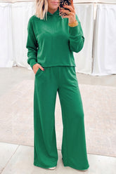 Woman in bright green cropped hoodie and wide leg pants set, mirror selfie