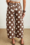 Back view of brown polka dot barrel leg jeans with elastic back waistband