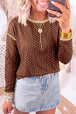 Brown polka dot long sleeve top with tan contrast trim, worn with a light denim mini skirt