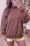 Brown polka dot mock neck sweatshirt with white dots and balloon sleeves, front view