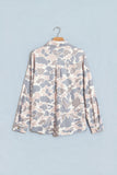 Pink and grey camo tunic shacket with back yoke on a hanger, back view