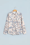 Pink and grey camo button down tunic shacket on a hanger, front view