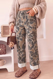 Camo straight leg jeans styled with a cropped knit and cardigan, side view