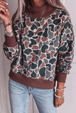 Women's camouflage quilted mock neck sweatshirt with brown ribbed trim, front view