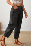 Side view of carbon grey cropped barrel leg jeans with patchwork seams