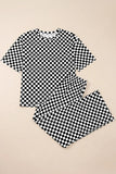 Black and white checkered shirt and shorts set on a beige background