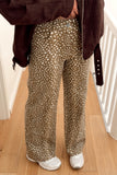 Brown cheetah print full length wide leg jeans, hand in pocket front view