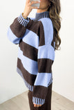 Woman in fuzzy brown-blue striped mock-neck sweater, mirror selfie in bright room.