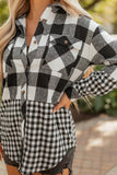 Person wearing a black and white checkered outfit with blurred background
