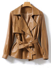 Brown leather jacket on a hanger against a white background