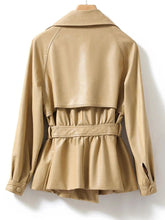 Beige trench coat on a white background