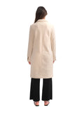 Woman wearing a beige coat on a white background