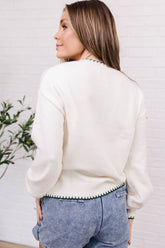 Cream knit sweater with red gingham plaid Christmas tree appliqué and green stitched trim