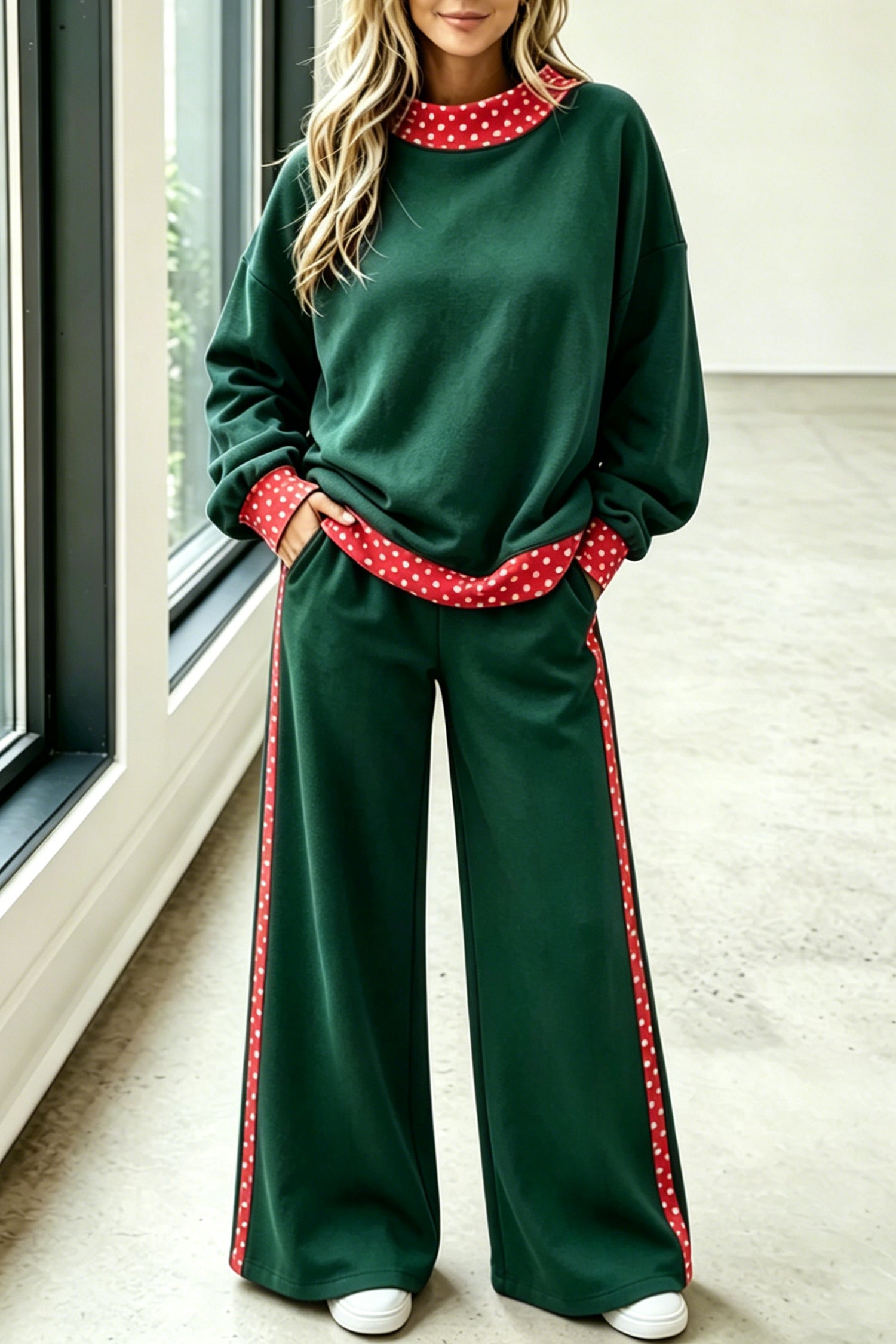 Green sweatshirt and wide-leg pants set with red polka dot trim, front view