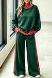 Green sweatshirt and wide-leg pants set with red polka dot trim, front view