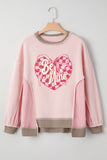 Pink sweatshirt with 'Be Mine' heart design on a hanger against a white background