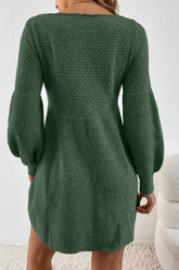 Green knitted dress worn by a person on a white background