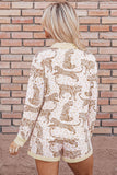 Woman viewed from behind in cream leopard-print top and matching shorts.