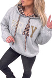 Women's light grey PRAY hoodie with mixed pattern letters, styled with dark jeans