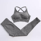 Gray sports bra and leggings set on a white background