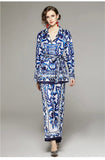 Woman wearing a blue and white patterned outfit on a gray background