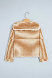 Mustard brown and cream striped cropped fuzzy knit sweater on hanger.